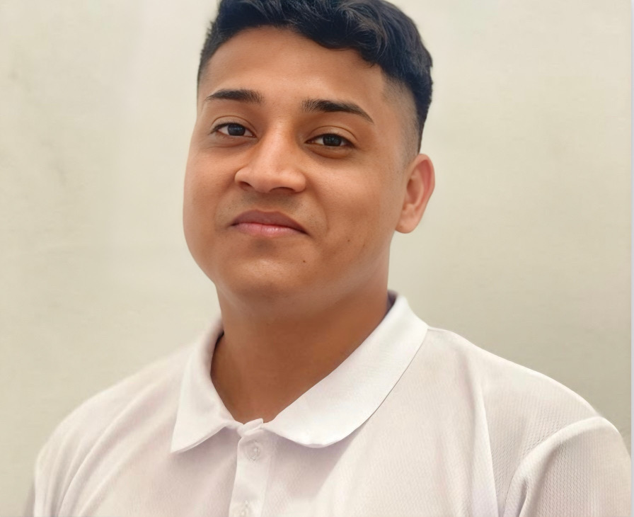 Portrait of Julian Santiago Jr. at a dock in Sarteneja, Belize